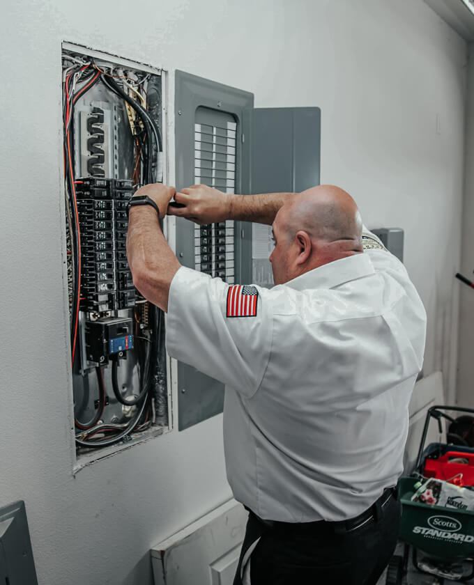 Milestone technician repairing electrical fuses in the garage